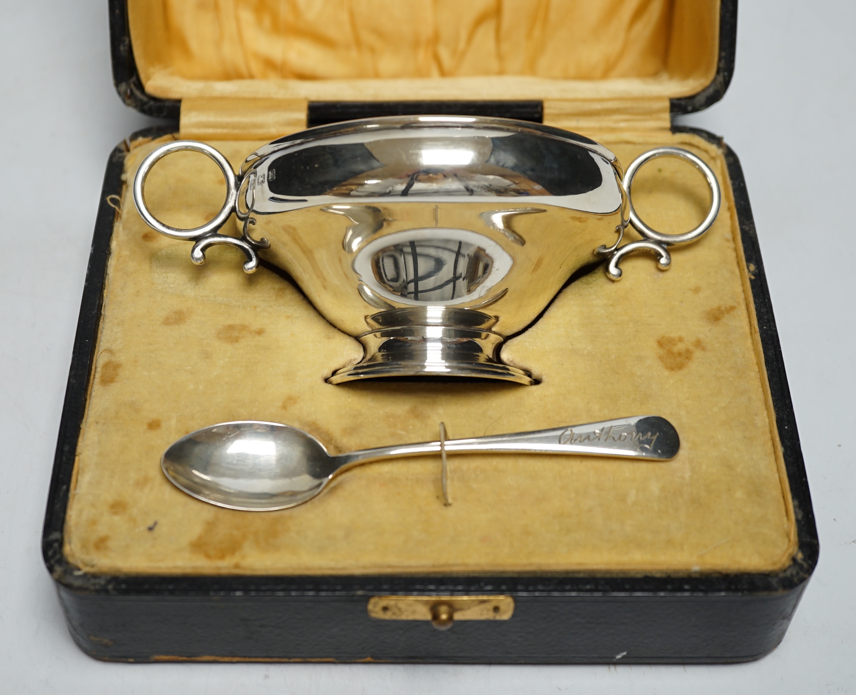 A George V cased silver christening bowl and spoon, Joseph Gloster Ltd, Birmingham, 1928/29, bowl diameter 92mm.